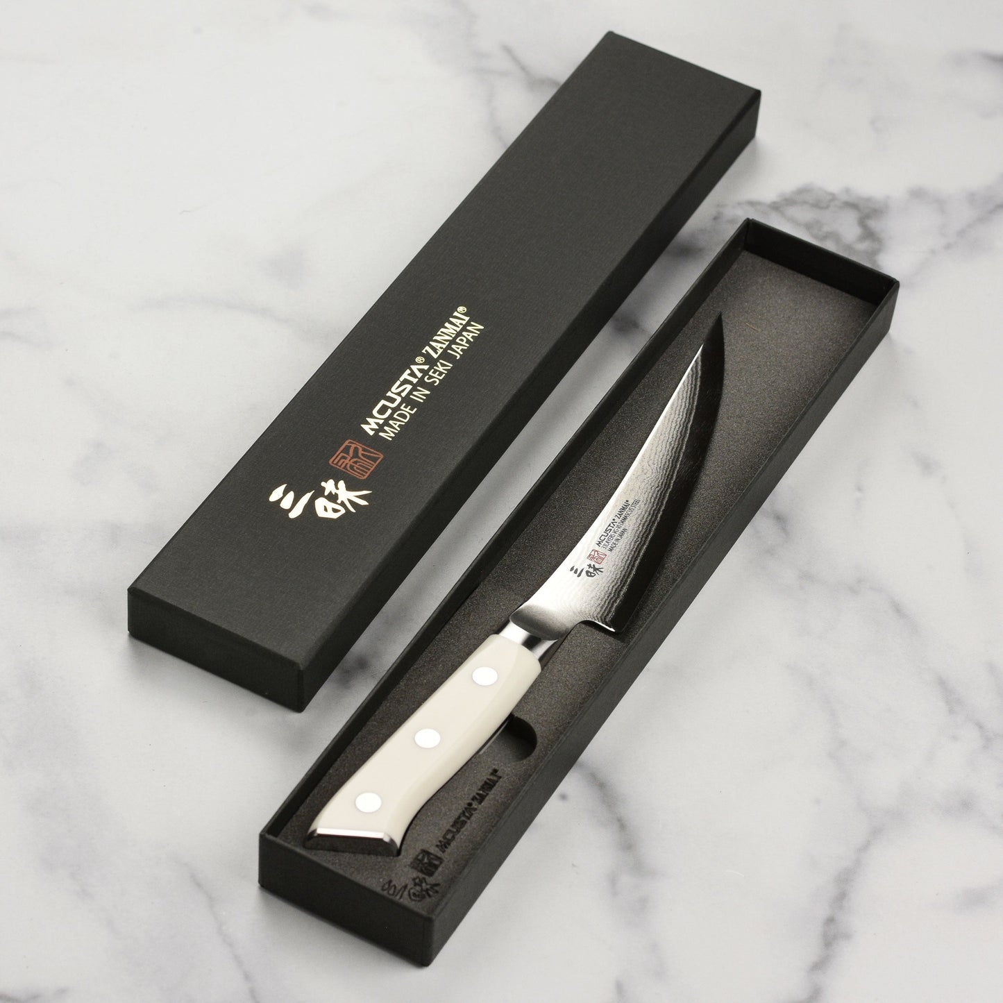 Zanmai Classic Damascus Corian 6.5" Curved Boning Knife