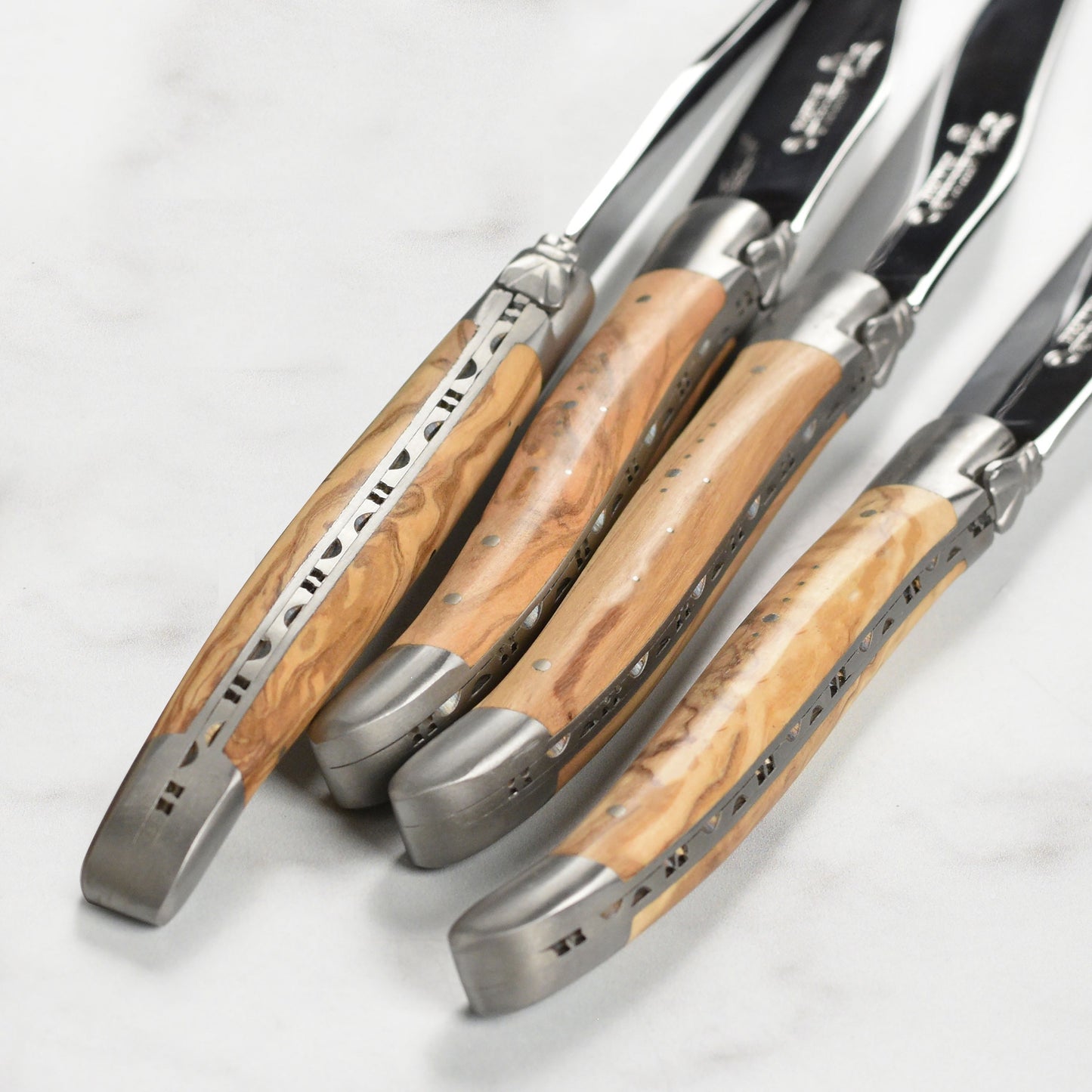 Laguiole en Aubrac 4 Piece Stainless Steel Steak Knife Set with Olive Wood Handles
